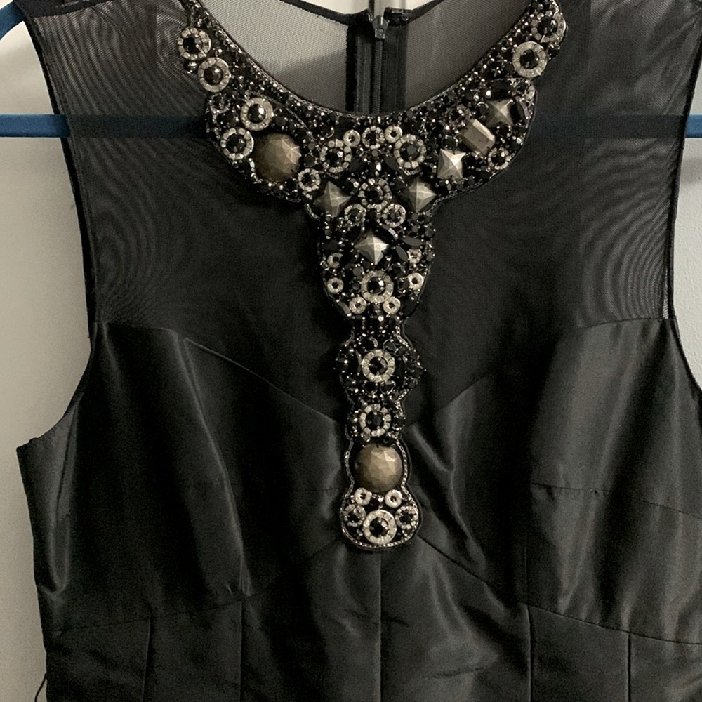 Sexy Black Evening Dress with mesh top and jeweled neckline . Aline style .